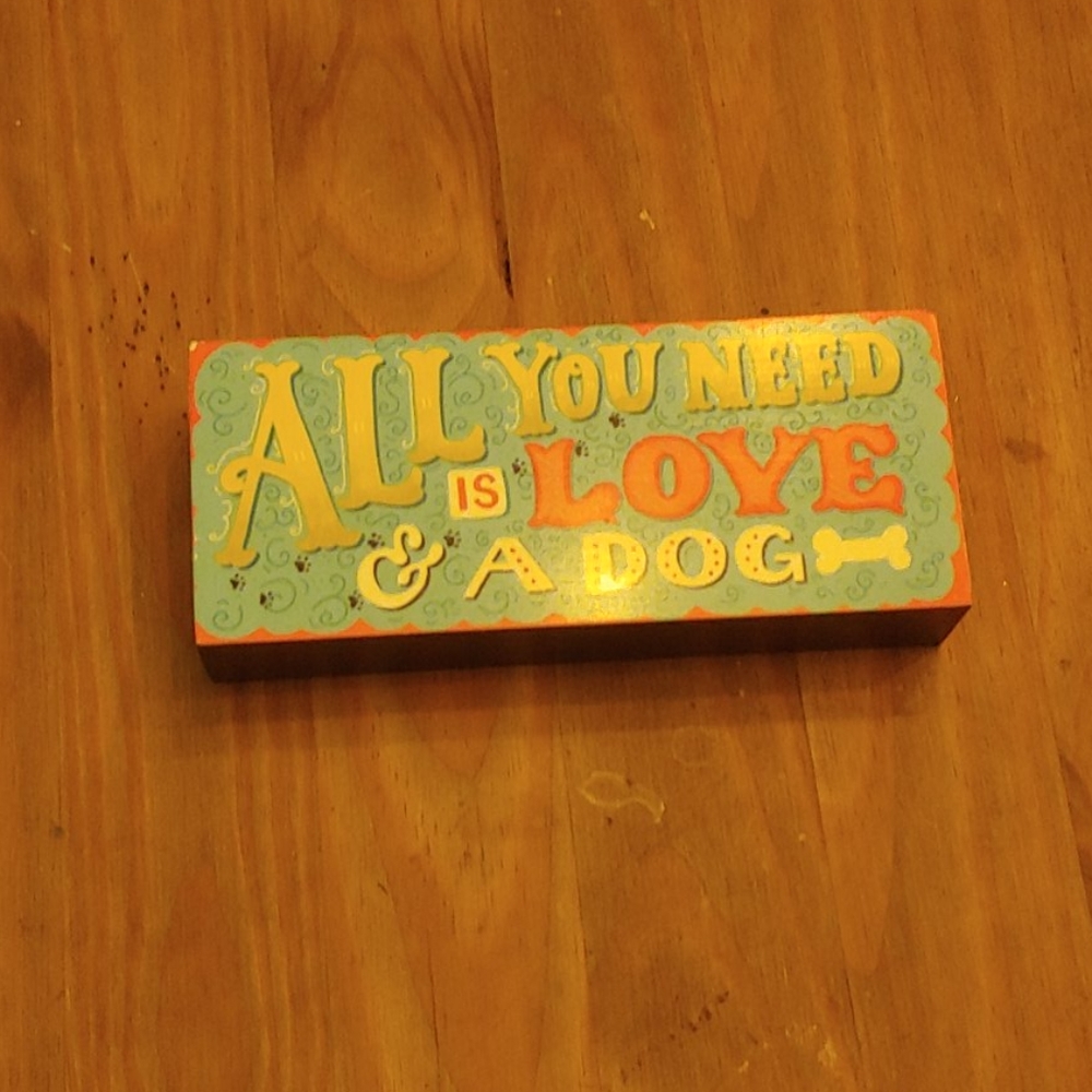Wooden dog-themed picture.